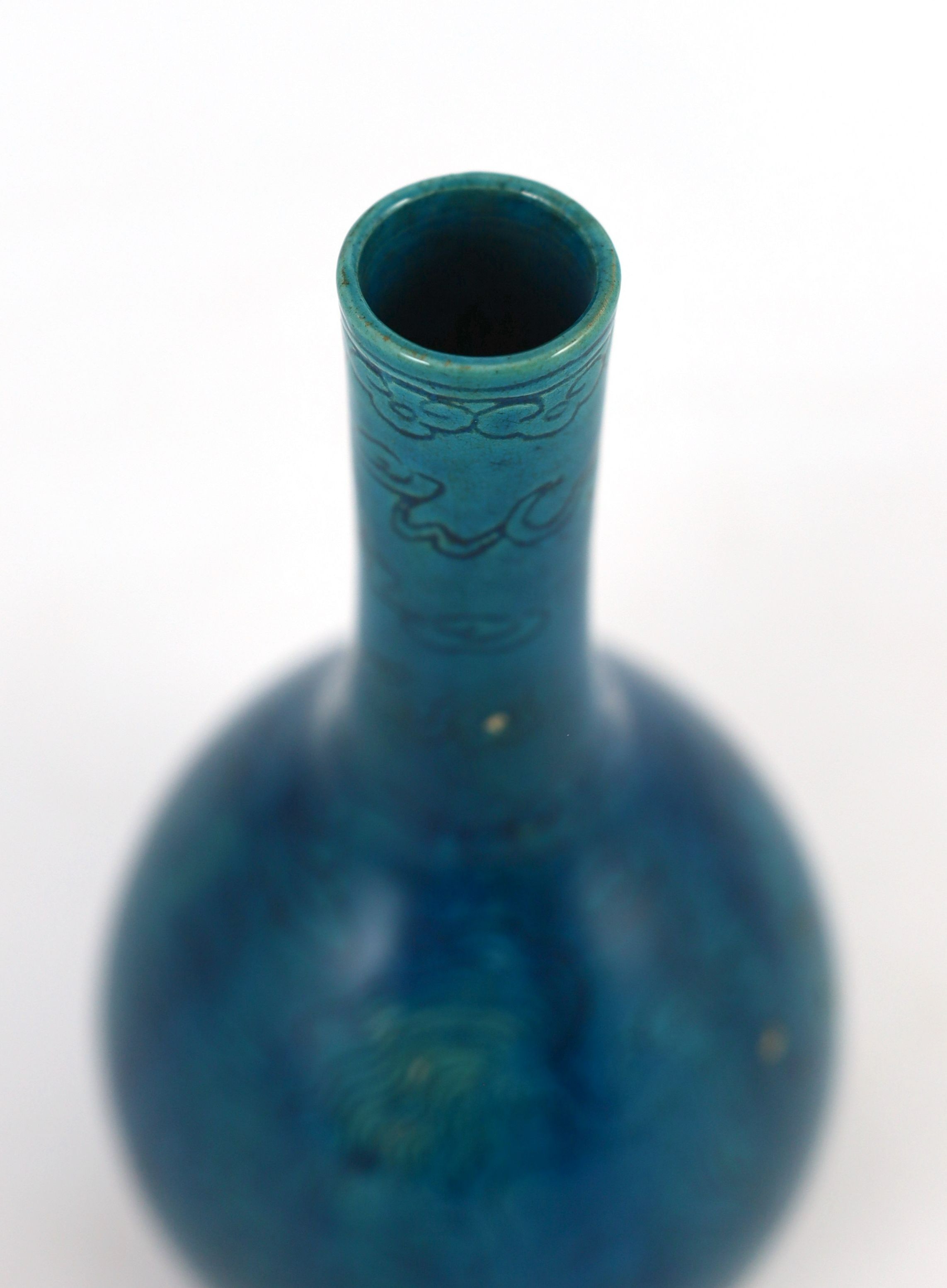 A Chinese turquoise glazed sgraffito bottle vase, 19th century, 21 cm high